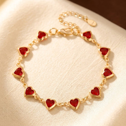 Złota bransoletka z rubinem w kształcie serca